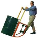 Man using the Rock-It drum cradle to tilt up a fifty-five gallon drum