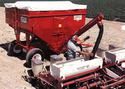 Man using Gravity-Bed Auger to fill seeder