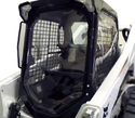 White skid-steer with black vinyl cab enclosure with clear vinyl windows